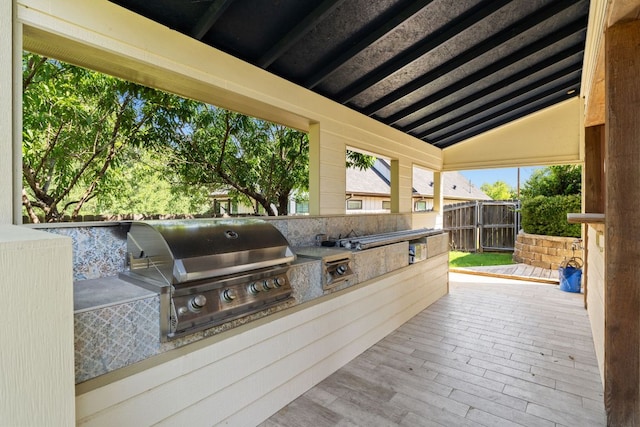 703 Amy Cir, Marble Falls, TX 78654 - wooden terrace with an outdoor kitchen