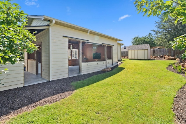 703 Amy Cir, Marble Falls, TX 78654 - view of yard with a storage shed and a sunroom