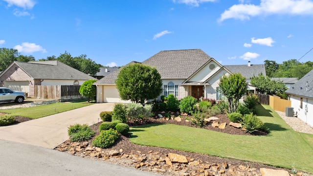 703 Amy Cir, Marble Falls, TX 78654 - view of front facade featuring concrete driveway, brick siding, and roof with shingles