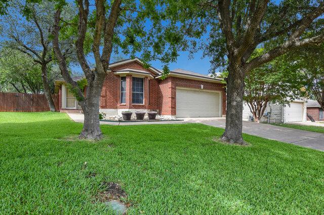 1119 Brinkley Dr, Cedar Park, TX 78613 - view of front of property featuring a garage, driveway, and brick siding