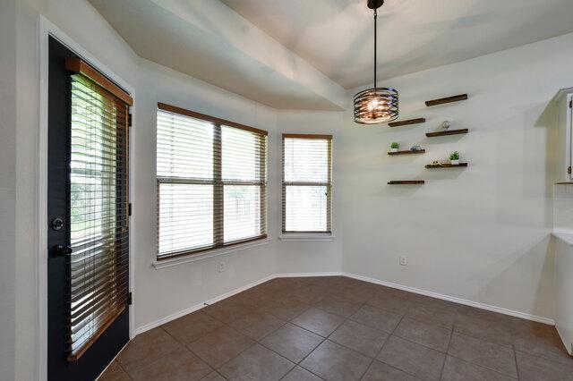 1119 Brinkley Dr, Cedar Park, TX 78613 - spare room featuring dark tile patterned floors
