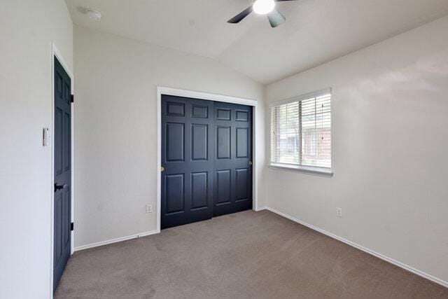 1119 Brinkley Dr, Cedar Park, TX 78613 - unfurnished bedroom with carpet floors, lofted ceiling, a closet, and ceiling fan