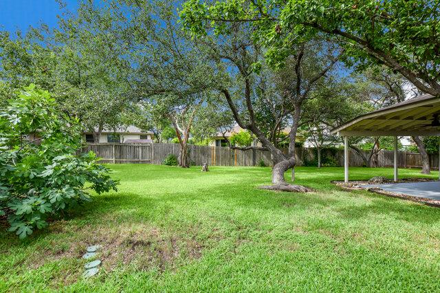 1119 Brinkley Dr, Cedar Park, TX 78613 - fenced backyard with a patio area