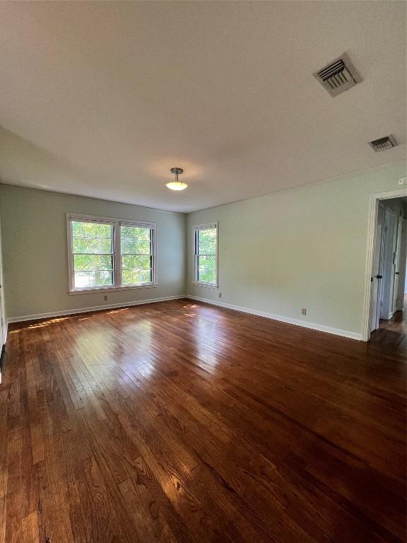 1511 Romeria Dr, Austin, TX 78757 - unfurnished room featuring dark wood-type flooring and baseboards