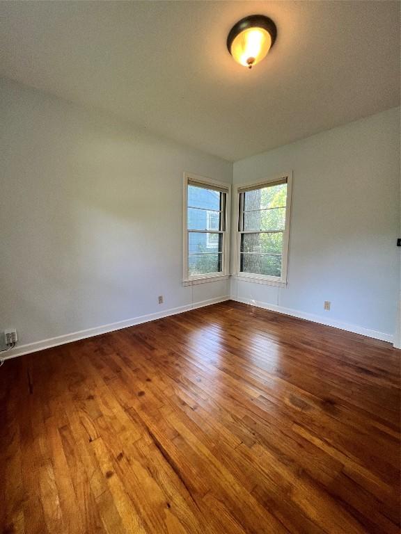 1511 Romeria Dr, Austin, TX 78757 - unfurnished room featuring wood finished floors and baseboards