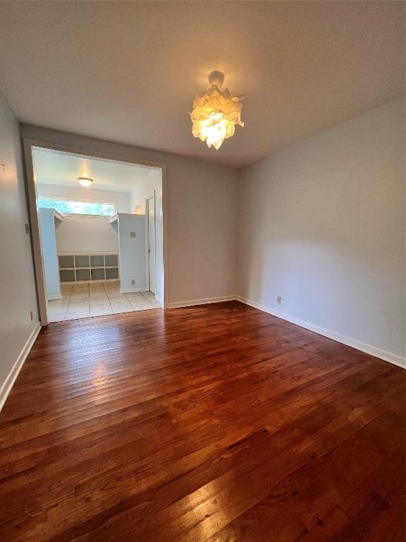 1511 Romeria Dr, Austin, TX 78757 - unfurnished room with wood-type flooring and baseboards