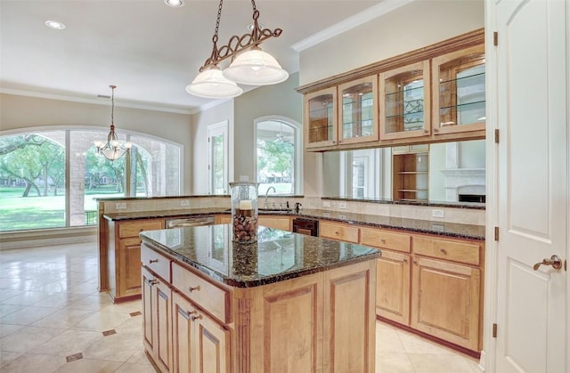 25 Meadows End Dr, Georgetown, TX 78628 - kitchen with ornamental molding, a peninsula, a center island, glass insert cabinets, and hanging light fixtures