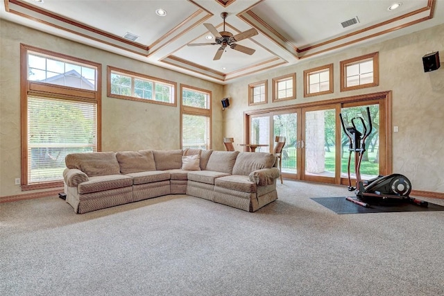 25 Meadows End Dr, Georgetown, TX 78628 - carpeted living area with a ceiling fan, healthy amount of natural light, a high ceiling, beam ceiling, and crown molding
