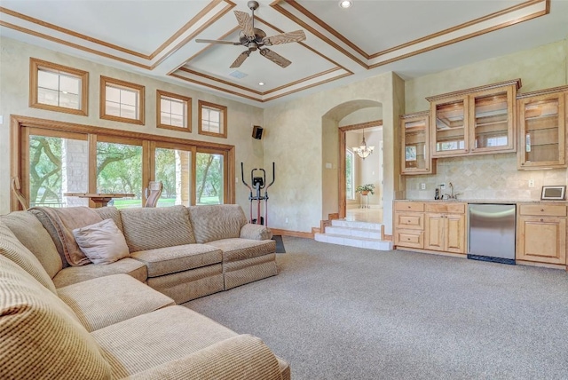 25 Meadows End Dr, Georgetown, TX 78628 - living room featuring arched walkways, light colored carpet, a ceiling fan, coffered ceiling, and crown molding