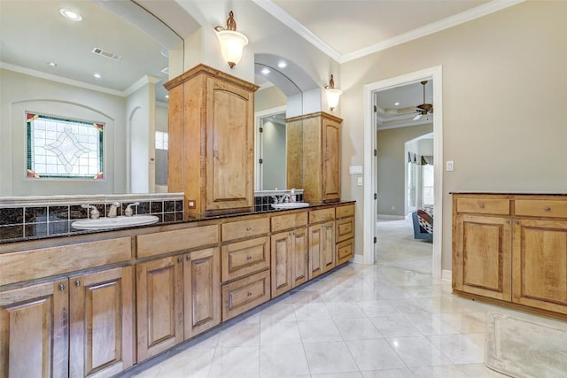 25 Meadows End Dr, Georgetown, TX 78628 - full bath featuring ornamental molding, double vanity, a ceiling fan, marble finish floors, and recessed lighting