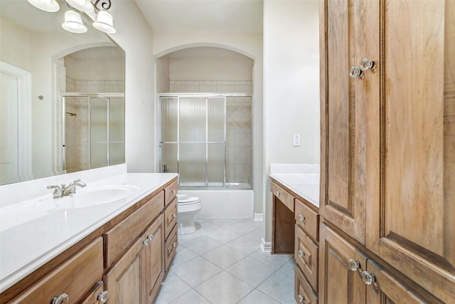25 Meadows End Dr, Georgetown, TX 78628 - bathroom featuring vanity, tile patterned floors, and bath / shower combo with glass door