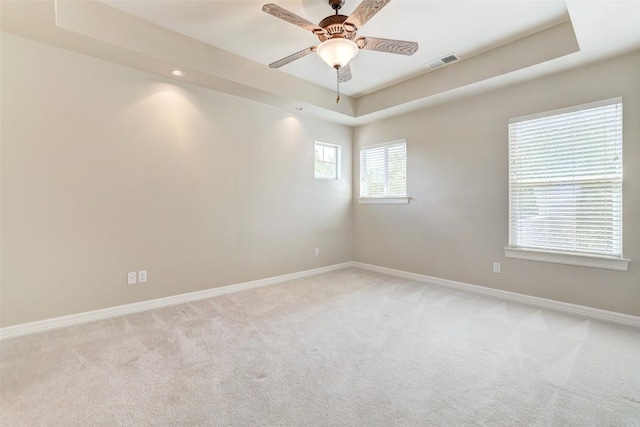 25 Meadows End Dr, Georgetown, TX 78628 - spare room with light colored carpet, a tray ceiling, a ceiling fan, and recessed lighting