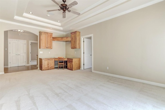 25 Meadows End Dr, Georgetown, TX 78628 - unfurnished living room with ceiling fan, ornamental molding, light carpet, arched walkways, and a raised ceiling