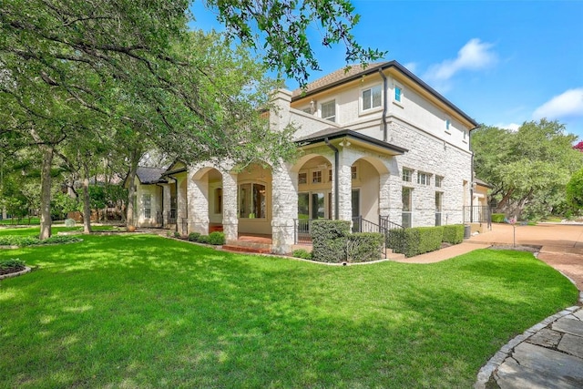 25 Meadows End Dr, Georgetown, TX 78628 - view of front of property featuring stone siding and a chimney