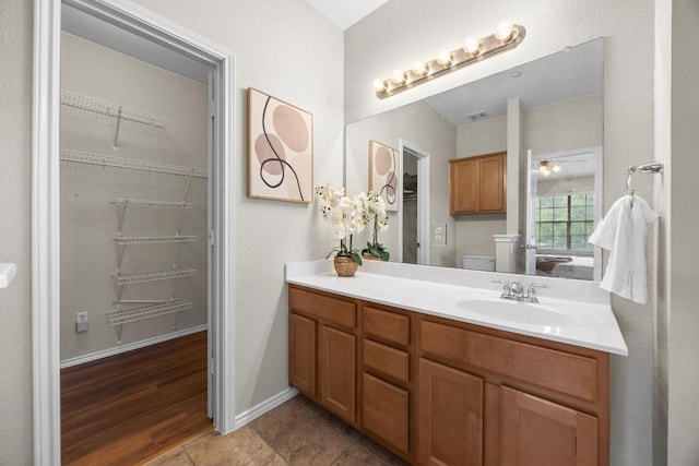 14815 Avery Ranch Blvd Unit 3301, Austin, TX 78717 - bathroom featuring vanity and a walk in closet