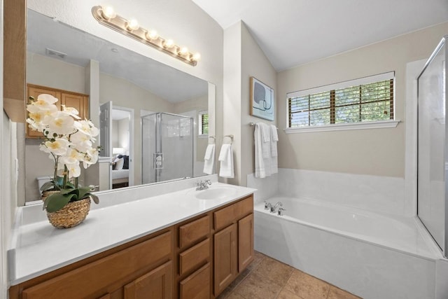 14815 Avery Ranch Blvd Unit 3301, Austin, TX 78717 - full bathroom with a shower stall, vanity, a garden tub, vaulted ceiling, and tile patterned flooring