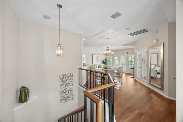 14815 Avery Ranch Blvd Unit 3301, Austin, TX 78717 - corridor with a chandelier, wood finished floors, an upstairs landing, and attic access