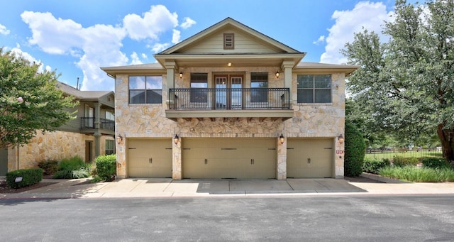 14815 Avery Ranch Blvd Unit 3301, Austin, TX 78717 - view of front of property with stone siding, an attached garage, and a balcony