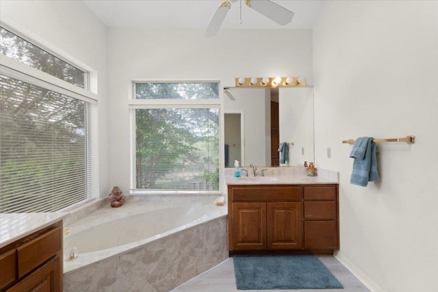124 Hurst Creek Rd, Austin, TX 78734 - bathroom with vanity, a bath, and a ceiling fan