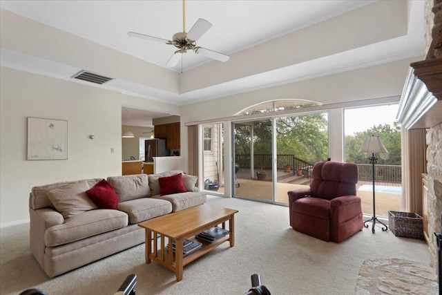 124 Hurst Creek Rd, Austin, TX 78734 - living room featuring light colored carpet, ceiling fan, crown molding, and a tray ceiling
