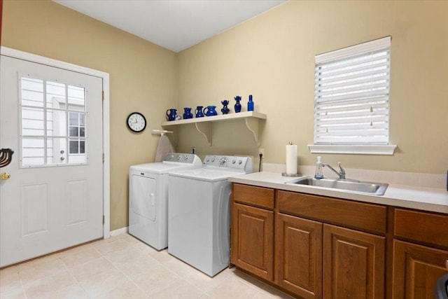 124 Hurst Creek Rd, Austin, TX 78734 - laundry area with independent washer and dryer, light tile patterned flooring, and cabinet space