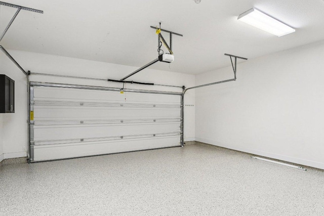 3213 Venezia Vw, Leander, TX 78641 - garage with a garage door opener and baseboards