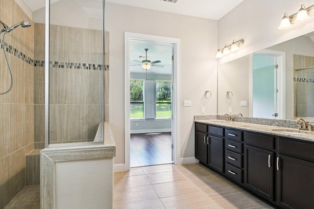 3213 Venezia Vw, Leander, TX 78641 - full bath with walk in shower, double vanity, a ceiling fan, and tile patterned flooring
