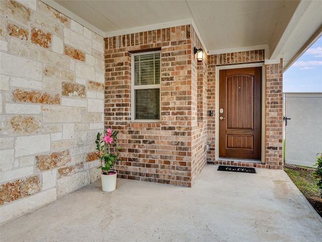 4811 Portillo Way, Pflugerville, TX 78660 - property entrance featuring covered porch and brick siding