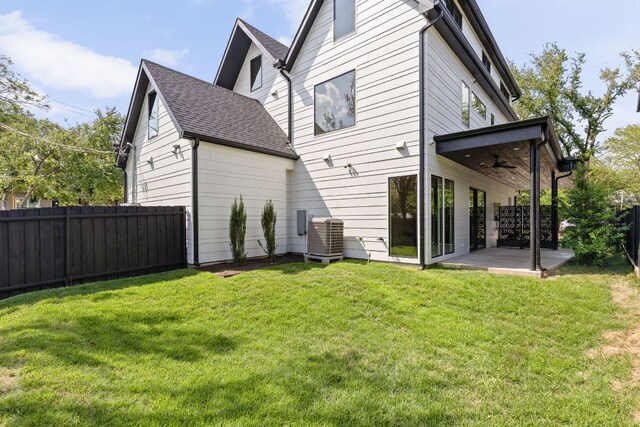 501 E 50th St, Austin, TX 78751 - back of house featuring ceiling fan, a patio area, a fenced backyard, and roof with shingles