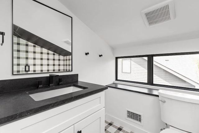 501 E 50th St, Austin, TX 78751 - bathroom with vanity, a shower, and vaulted ceiling