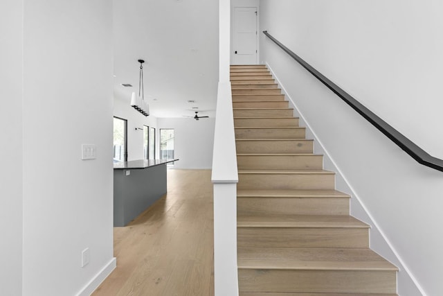 501 E 50th St, Austin, TX 78751 - stairs featuring wood finished floors and baseboards