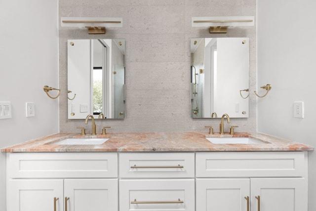 501 E 50th St, Austin, TX 78751 - full bathroom featuring double vanity and decorative backsplash