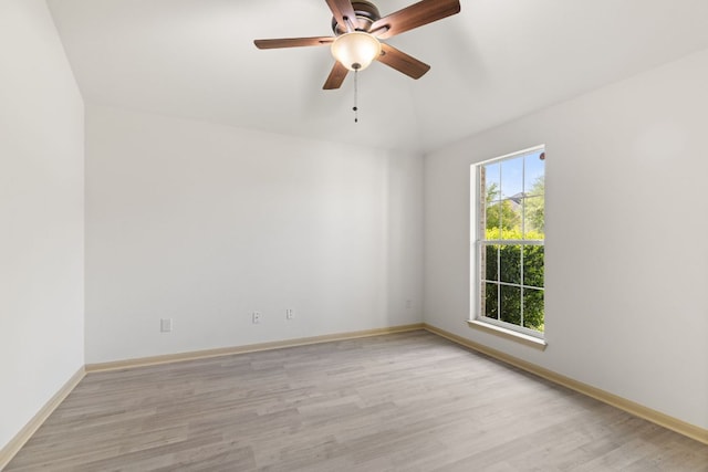 325 Swenson Dr, Hutto, TX 78634 - empty room with light wood-style floors, a ceiling fan, and lofted ceiling