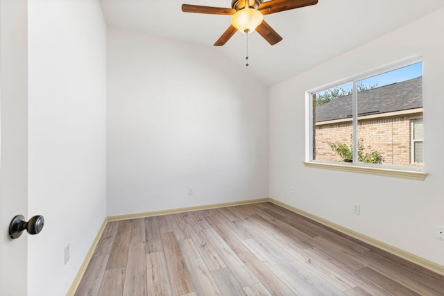 325 Swenson Dr, Hutto, TX 78634 - empty room featuring wood finished floors, lofted ceiling, and ceiling fan