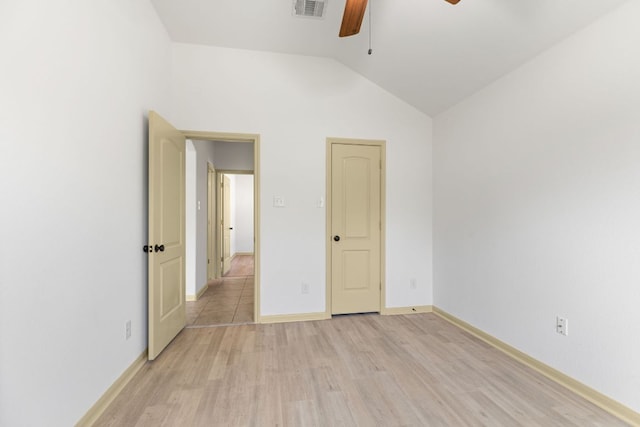 325 Swenson Dr, Hutto, TX 78634 - unfurnished bedroom with light wood-style flooring, lofted ceiling, and a ceiling fan