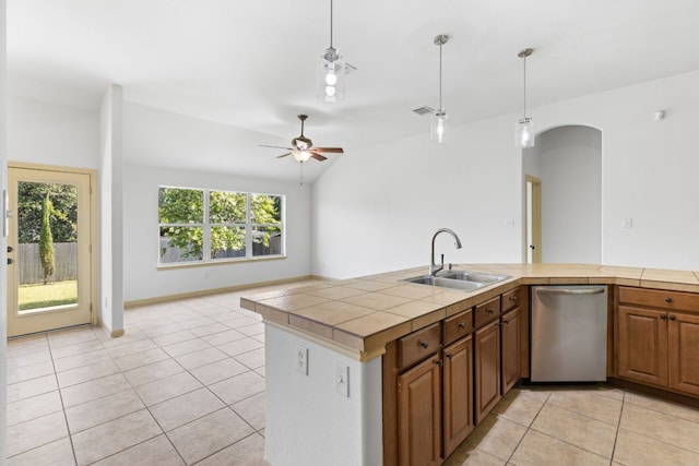 325 Swenson Dr, Hutto, TX 78634 - kitchen with dishwasher, light tile patterned floors, pendant lighting, arched walkways, and a ceiling fan