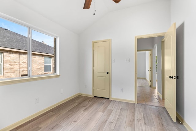 325 Swenson Dr, Hutto, TX 78634 - unfurnished bedroom featuring lofted ceiling and light wood-style flooring
