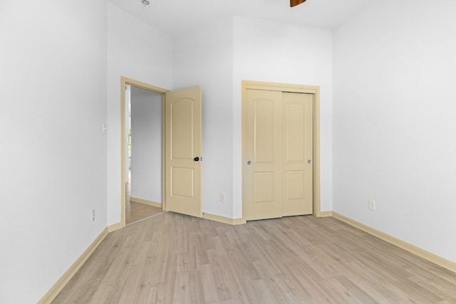 325 Swenson Dr, Hutto, TX 78634 - unfurnished bedroom featuring light wood-style flooring and a ceiling fan