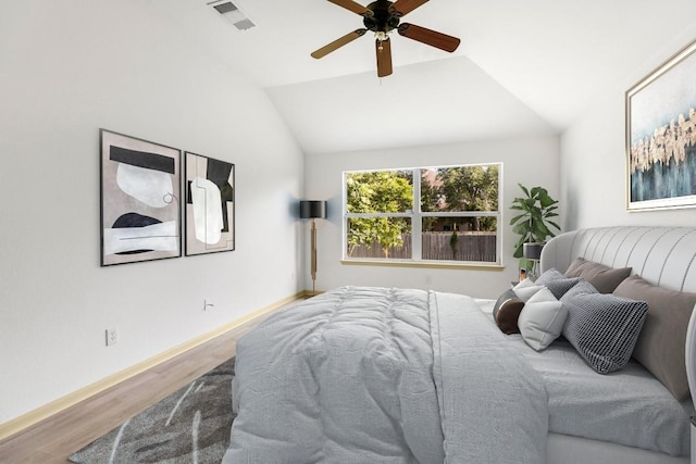 325 Swenson Dr, Hutto, TX 78634 - bedroom featuring wood finished floors, lofted ceiling, and a ceiling fan