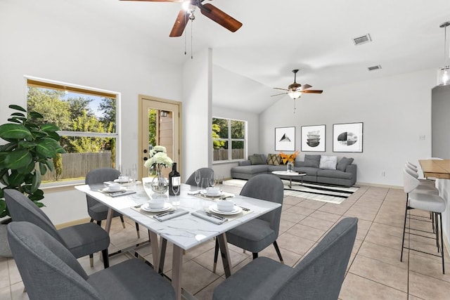 325 Swenson Dr, Hutto, TX 78634 - dining area featuring ceiling fan, light tile patterned floors, and high vaulted ceiling