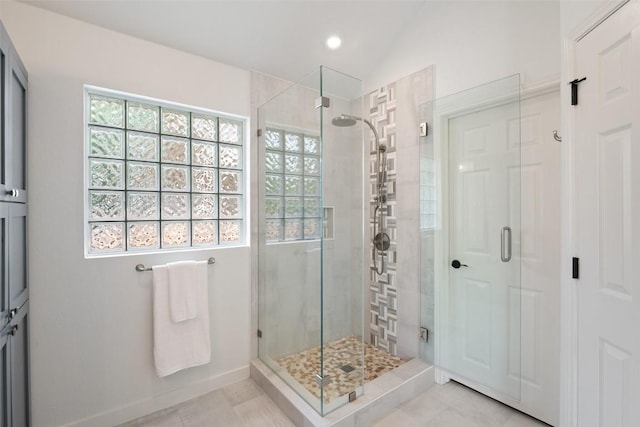 4608 Hibiscus Valley Dr, Austin, TX 78739 - full bathroom with a shower stall, healthy amount of natural light, recessed lighting, vaulted ceiling, and tile patterned flooring