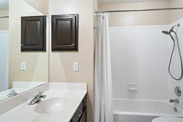 4608 Hibiscus Valley Dr, Austin, TX 78739 - bathroom featuring vanity, a textured wall, and shower / tub combo with curtain