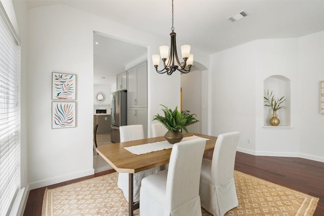 4608 Hibiscus Valley Dr, Austin, TX 78739 - dining space with a chandelier, wood finished floors, and plenty of natural light