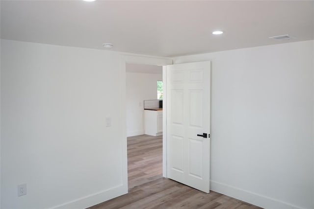 545 W Vaughan St, Bertram, TX 78605 - unfurnished room featuring light wood-style floors and recessed lighting