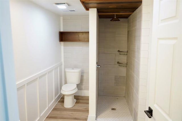 545 W Vaughan St, Bertram, TX 78605 - bathroom with a stall shower and wood finished floors