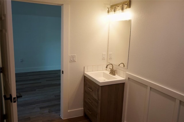 545 W Vaughan St, Bertram, TX 78605 - bathroom featuring vanity and wood finished floors
