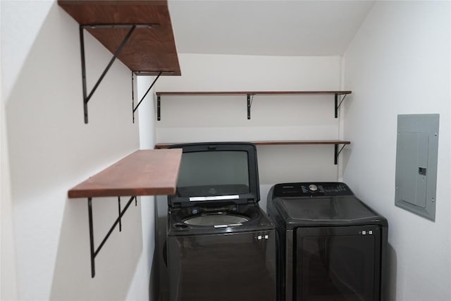 545 W Vaughan St, Bertram, TX 78605 - laundry room featuring electric panel and washer and dryer