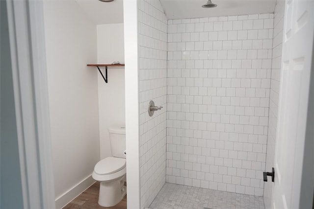 545 W Vaughan St, Bertram, TX 78605 - bathroom with a shower stall and wood finished floors