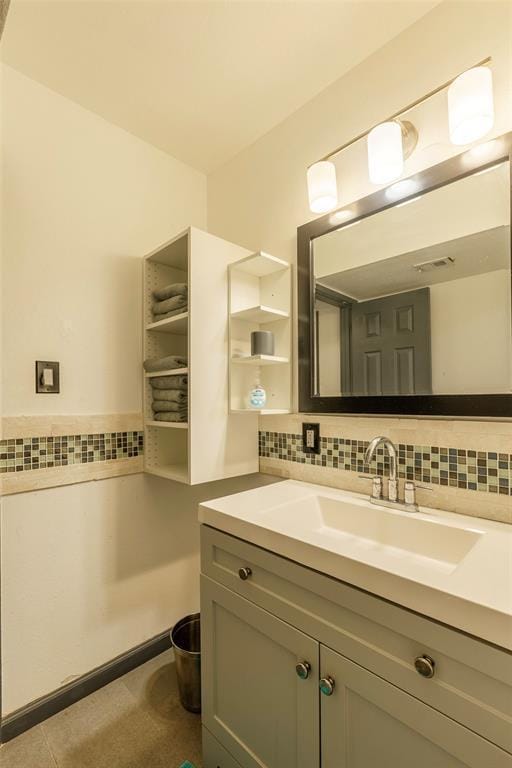 3431 N Hills Dr Unit 115, Austin, TX 78731 - bathroom with vanity and decorative backsplash