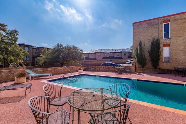 3431 N Hills Dr Unit 115, Austin, TX 78731 - community pool with a patio and a residential view